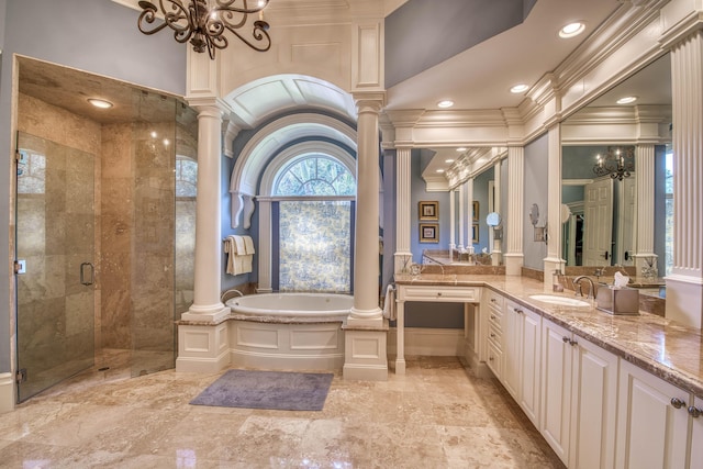 7656 Steeplechase Dr, Palm Beach Gardens, FL 33418 - bathroom with decorative columns, a chandelier, a garden tub, vanity, and a stall shower