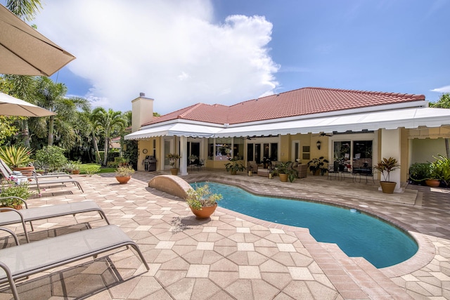 7656 Steeplechase Dr, Palm Beach Gardens, FL 33418 - outdoor pool with a patio area, outdoor lounge area, and grilling area