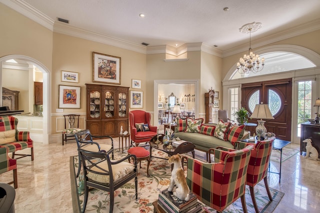 7656 Steeplechase Dr, Palm Beach Gardens, FL 33418 - living area with crown molding, a chandelier, a textured ceiling, and arched walkways