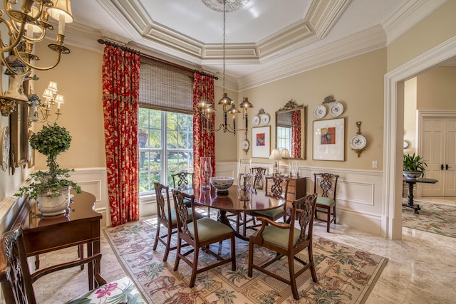 7656 Steeplechase Dr, Palm Beach Gardens, FL 33418 - dining space with a chandelier, a decorative wall, ornamental molding, wainscoting, and a raised ceiling