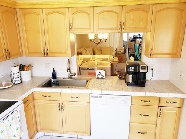 708 Laconia Cir Unit 708, Lake Worth, FL 33467 - kitchen featuring white appliances, a sink, backsplash, and light brown cabinetry