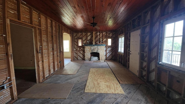 1709 N Palmway, Lake Worth Beach, FL 33460 - unfurnished living room featuring wooden ceiling, a fireplace, a ceiling fan, and arched walkways