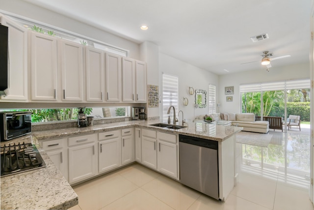 1522 Carafe Ct, Palm Beach Gardens, FL 33410 - kitchen featuring a sink, stainless steel appliances, light tile patterned floors, a peninsula, and open floor plan
