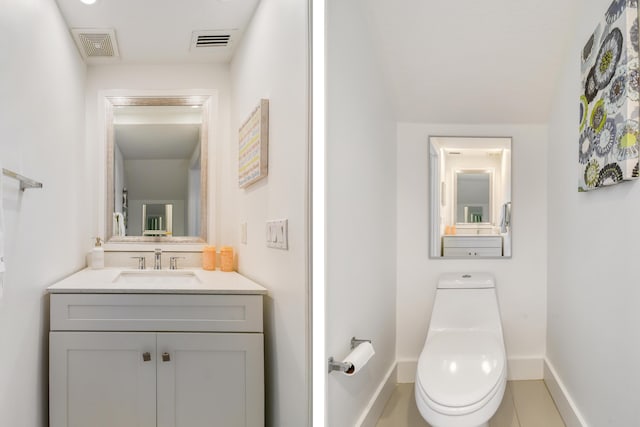 1522 Carafe Ct, Palm Beach Gardens, FL 33410 - bathroom featuring baseboards, toilet, and vanity