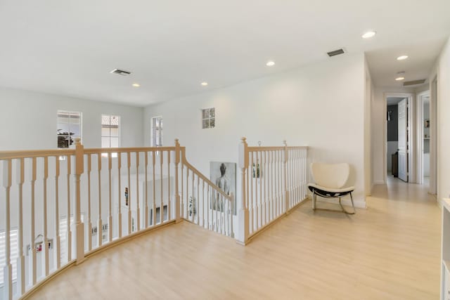1522 Carafe Ct, Palm Beach Gardens, FL 33410 - hallway featuring wood finished floors, an upstairs landing, recessed lighting, and baseboards