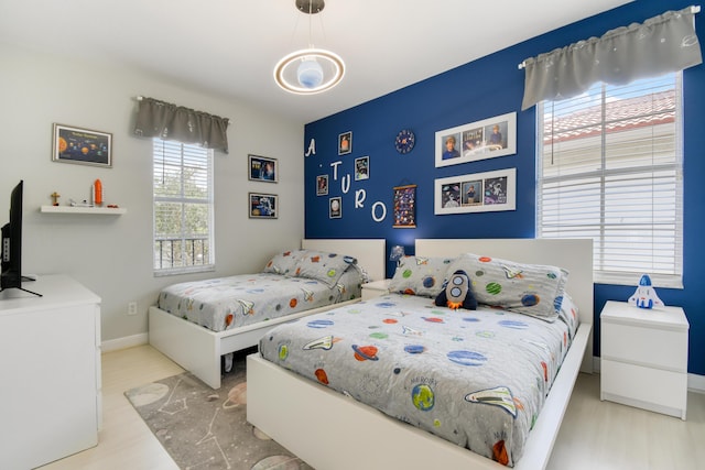 1522 Carafe Ct, Palm Beach Gardens, FL 33410 - bedroom featuring wood finished floors and baseboards