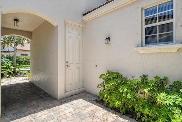 1522 Carafe Ct, Palm Beach Gardens, FL 33410 - doorway to property featuring stucco siding