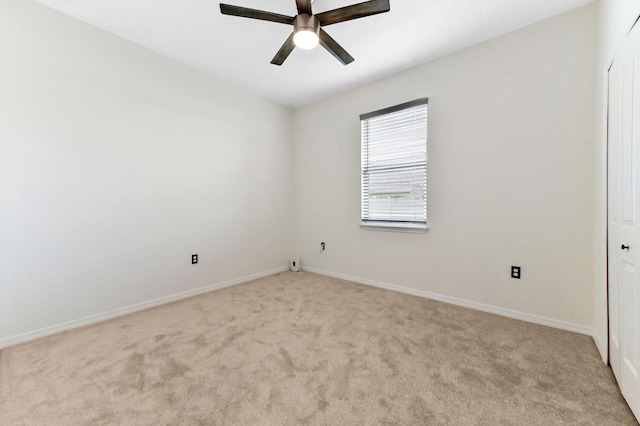 6700 NW Omega Rd, Port Saint Lucie, FL 34983 - spare room with light carpet, a ceiling fan, and baseboards