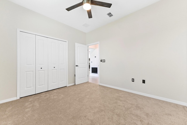 6700 NW Omega Rd, Port Saint Lucie, FL 34983 - unfurnished bedroom with light colored carpet, baseboards, and a closet