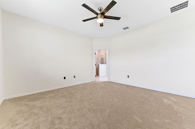 6700 NW Omega Rd, Port Saint Lucie, FL 34983 - empty room with light carpet, a ceiling fan, and baseboards