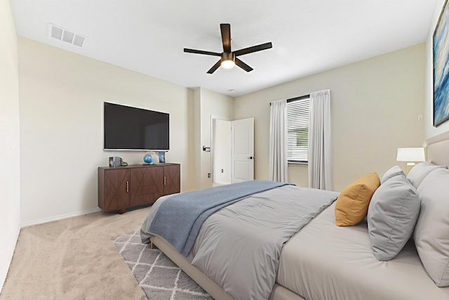 6700 NW Omega Rd, Port Saint Lucie, FL 34983 - carpeted bedroom with baseboards and ceiling fan