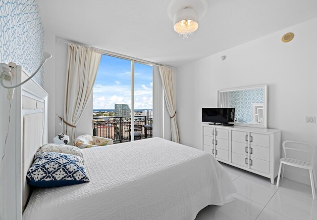 550 Okeechobee Blvd Unit Uph-15, West Palm Beach, FL 33401 - bedroom with access to exterior and light tile patterned floors