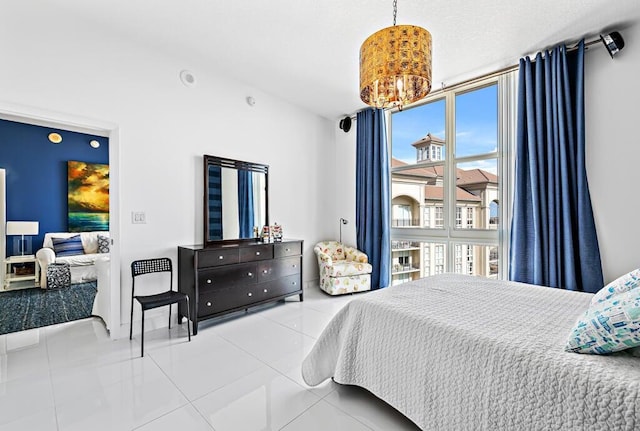 550 Okeechobee Blvd Unit Uph-15, West Palm Beach, FL 33401 - bedroom with tile patterned flooring and a chandelier