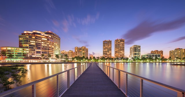 716 21st St, West Palm Beach, FL 33407 - dock area featuring a skyline view and a water view