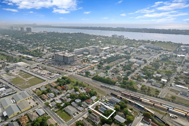 716 21st St, West Palm Beach, FL 33407 - aerial view of property and surrounding area with property parcel outlined, a large body of water, and nearby urban area
