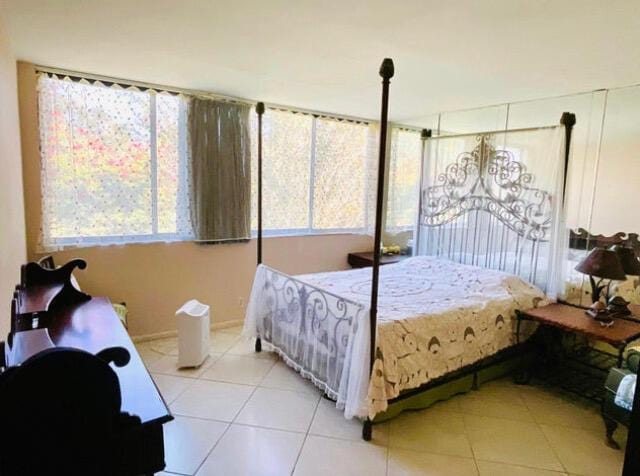 2520 Presidential Way Unit 205, West Palm Beach, FL 33401 - bedroom featuring light tile patterned floors