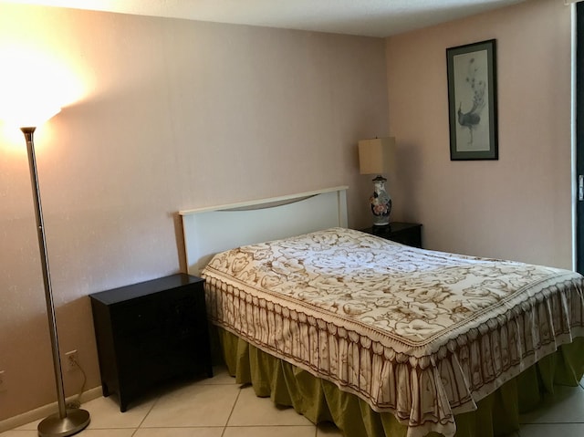 2520 Presidential Way Unit 205, West Palm Beach, FL 33401 - bedroom featuring light tile patterned flooring and baseboards