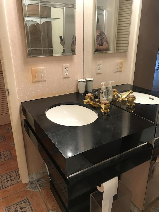 2520 Presidential Way Unit 205, West Palm Beach, FL 33401 - bathroom with vanity and tile patterned flooring