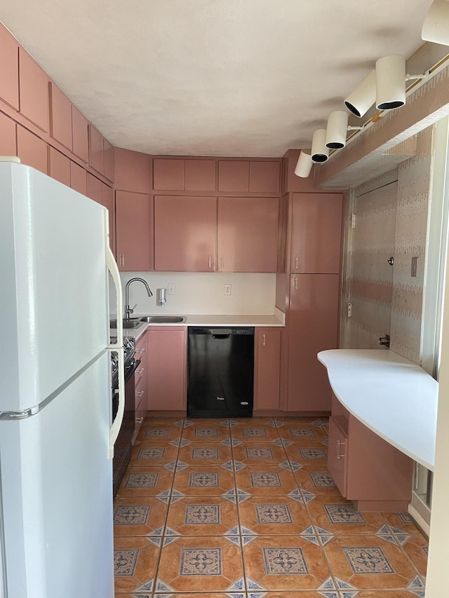 2520 Presidential Way Unit 205, West Palm Beach, FL 33401 - kitchen featuring freestanding refrigerator, black dishwasher, a sink, light countertops, and stove