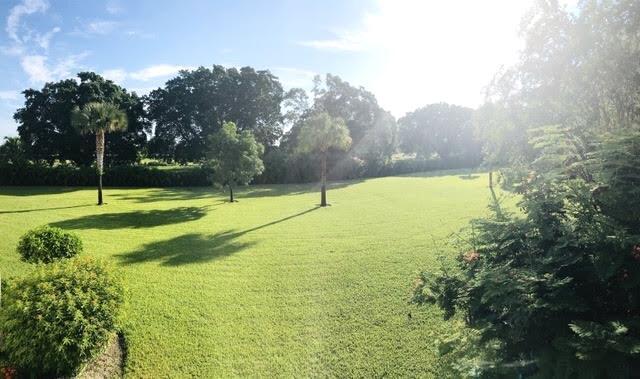 2520 Presidential Way Unit 205, West Palm Beach, FL 33401 - view of home's community with a yard