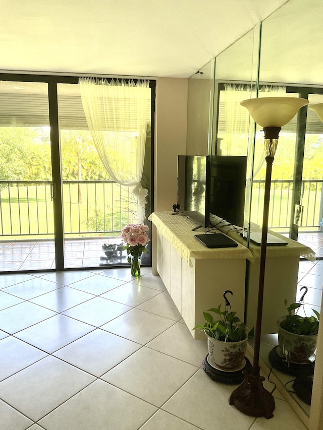 2520 Presidential Way Unit 205, West Palm Beach, FL 33401 - living room with healthy amount of natural light and light tile patterned floors