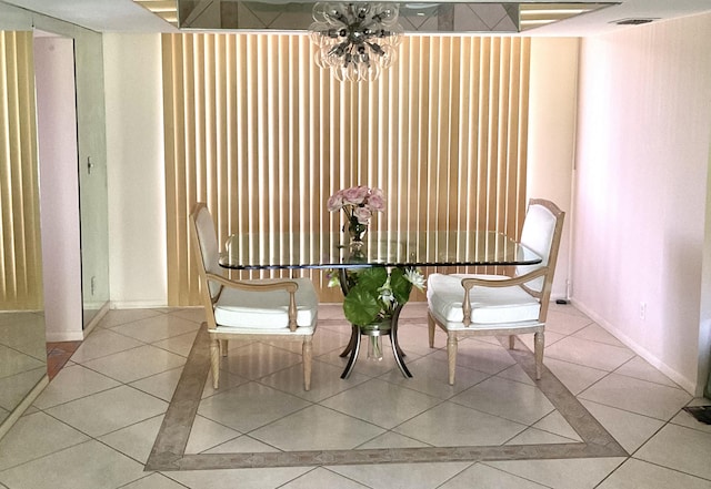 2520 Presidential Way Unit 205, West Palm Beach, FL 33401 - tiled dining space with baseboards and a chandelier