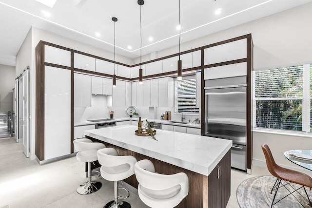 6357 Graycliff Dr Unit C, Boca Raton, FL 33496 - kitchen featuring stainless steel built in refrigerator, modern cabinets, white cabinets, a kitchen island, and recessed lighting