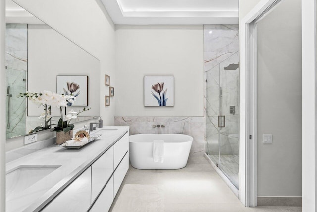6357 Graycliff Dr Unit C, Boca Raton, FL 33496 - full bath with a marble finish shower, double vanity, a soaking tub, tile walls, and wainscoting