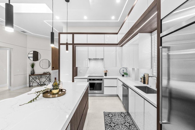 6357 Graycliff Dr Unit C, Boca Raton, FL 33496 - kitchen featuring appliances with stainless steel finishes, modern cabinets, white cabinets, light stone countertops, and recessed lighting