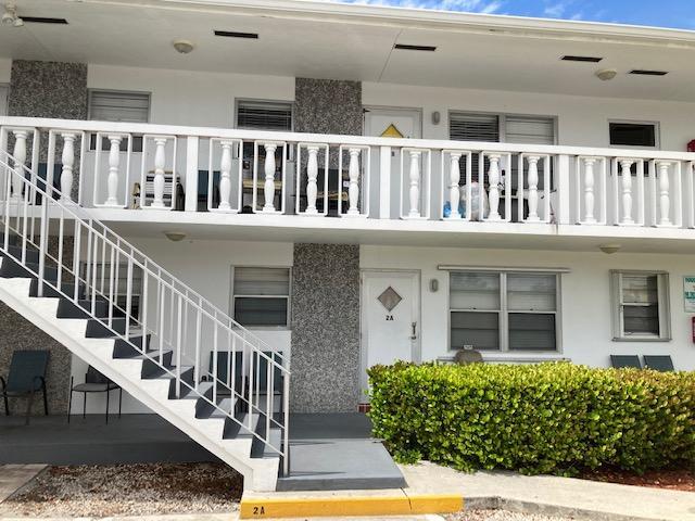 602 N H St Unit 1A, 2A, 3A, 5B, 7B, 8B, Lake Worth Beach, FL 33460 - view of building exterior featuring stairway