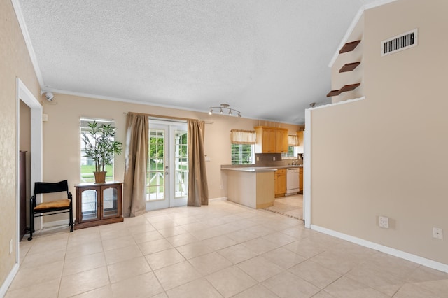 23444 Shetland Run, Boca Raton, FL 33433 - unfurnished living room with a textured ceiling, crown molding, light tile patterned floors, french doors, and baseboards