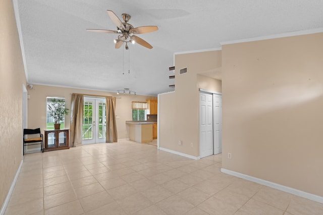 23444 Shetland Run, Boca Raton, FL 33433 - unfurnished living room with ceiling fan, ornamental molding, baseboards, a textured ceiling, and light tile patterned flooring