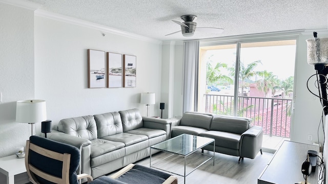 1801 N Flagler Dr Unit 622, West Palm Beach, FL 33407 - living area with a textured ceiling, a ceiling fan, crown molding, and wood finished floors