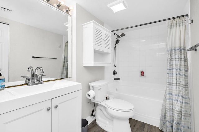1801 N Flagler Dr Unit 622, West Palm Beach, FL 33407 - full bathroom with wood finished floors, toilet, shower / bathtub combination with curtain, and vanity