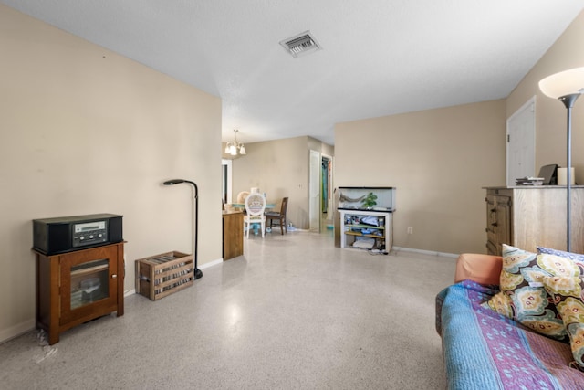 590 SE Anchor Ln, Port Saint Lucie, FL 34983 - living area featuring speckle patterned floor and a chandelier