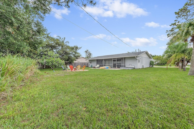 590 SE Anchor Ln, Port Saint Lucie, FL 34983 - view of grassy yard with a sunroom