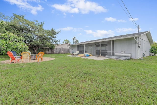 590 SE Anchor Ln, Port Saint Lucie, FL 34983 - view of yard featuring a sunroom and an outdoor fire pit