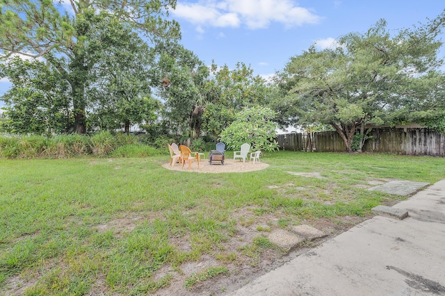 590 SE Anchor Ln, Port Saint Lucie, FL 34983 - view of yard featuring an outdoor fire pit and a patio area