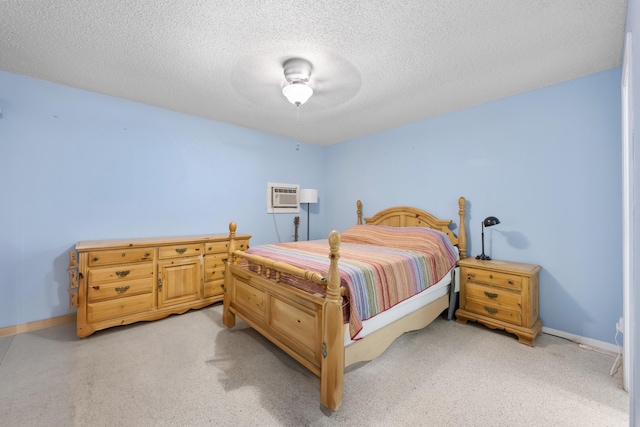 590 SE Anchor Ln, Port Saint Lucie, FL 34983 - bedroom with a textured ceiling, a wall unit AC, and ceiling fan