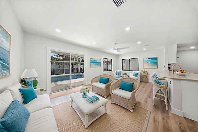 948 Canal Cir, Sebastian, FL 32958 - living room featuring light wood-type flooring, a ceiling fan, and recessed lighting