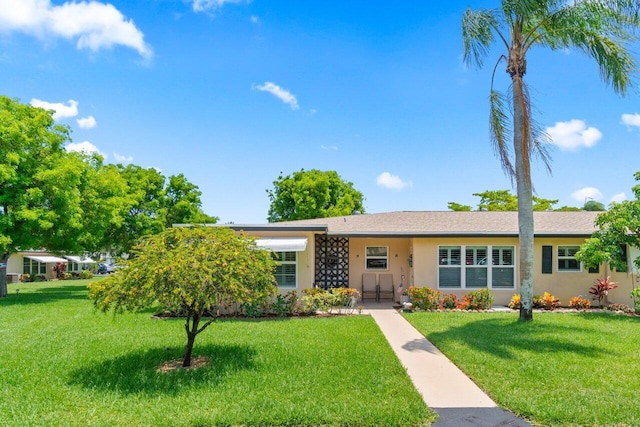 1012 Circle Ter E Unit A, Delray Beach, FL 33445 - ranch-style house with a front lawn and stucco siding