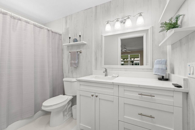1012 Circle Ter E Unit A, Delray Beach, FL 33445 - bathroom with toilet, vanity, a ceiling fan, and curtained shower