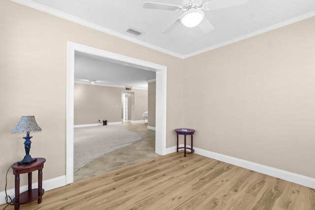 1012 Circle Ter E Unit A, Delray Beach, FL 33445 - spare room with light wood finished floors, ornamental molding, a ceiling fan, and baseboards
