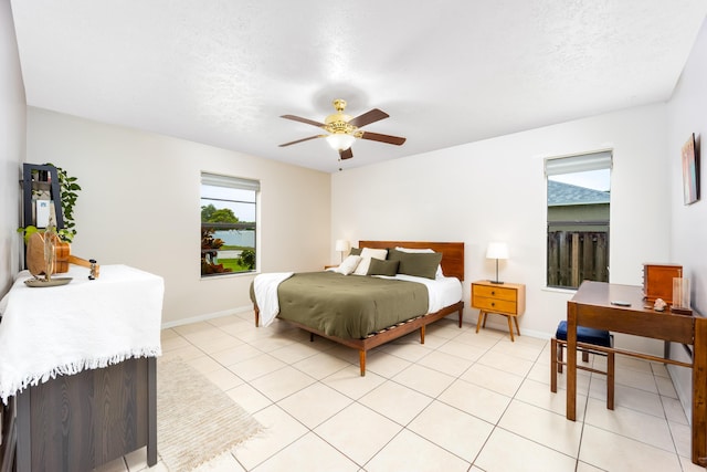 782 NW Kilpatrick Ave, Port Saint Lucie, FL 34983 - bedroom featuring baseboards, ceiling fan, and light tile patterned flooring