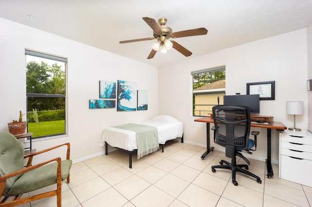 782 NW Kilpatrick Ave, Port Saint Lucie, FL 34983 - bedroom featuring an office area, baseboards, and light tile patterned flooring
