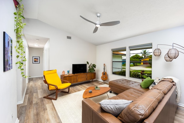 782 NW Kilpatrick Ave, Port Saint Lucie, FL 34983 - living room with vaulted ceiling, wood finished floors, ceiling fan, and baseboards