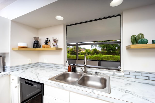 782 NW Kilpatrick Ave, Port Saint Lucie, FL 34983 - kitchen with a sink, open shelves, black dishwasher, and white cabinetry