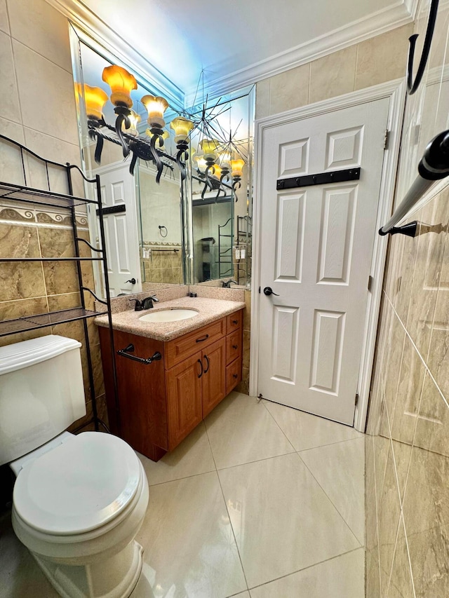 6074 Forest Hill Blvd Unit 107, West Palm Beach, FL 33415 - bathroom featuring crown molding, vanity, tile walls, toilet, and a chandelier