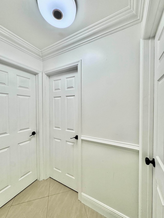 6074 Forest Hill Blvd Unit 107, West Palm Beach, FL 33415 - hall with light tile patterned floors and crown molding