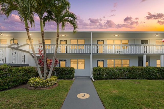 189 Prescott J 189, Deerfield Beach, FL 33442 - view of front of house with a lawn and stucco siding